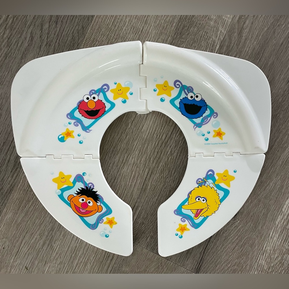Collapsible Sesame Street toilet seat cover